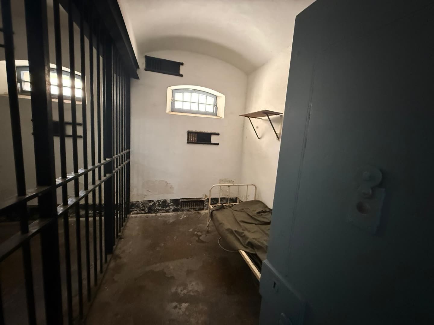 The iron bed - bolted to the floor