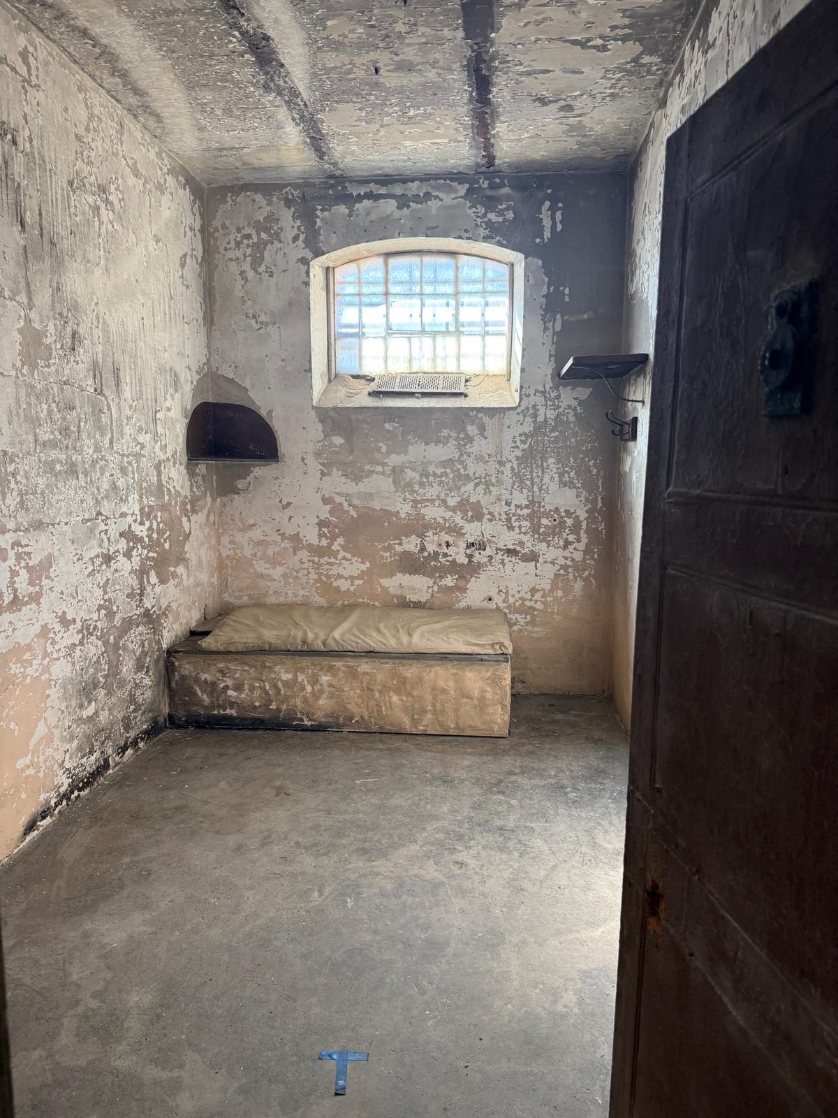 Cell with iron bed and barred window